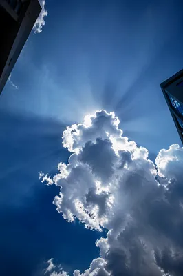 Sun Rays Breaking Through Towering Clouds