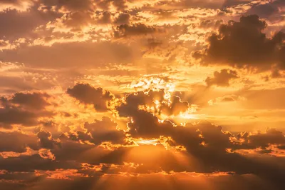 Golden Sun Rays Breaking Through Clouds