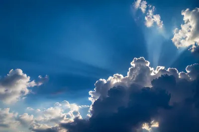 Sun Rays Breaking Through Cumulus Clouds