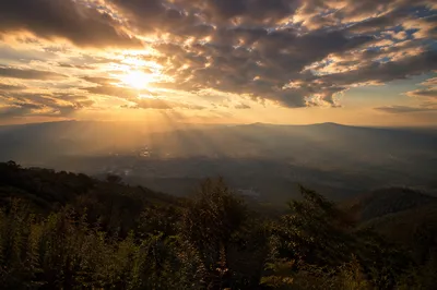 Sun Rays Breaking Through Golden Clouds