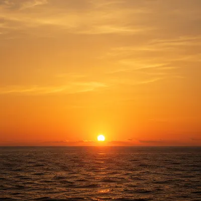 Golden Sunset Over Calm Ocean Horizon