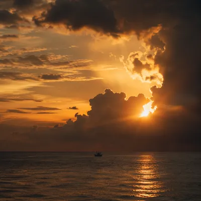 Golden Sunset Ocean Horizon with Distant Boat