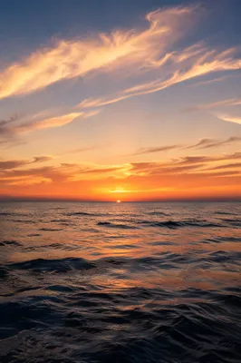 Golden Sunset Over Calm Ocean Horizon