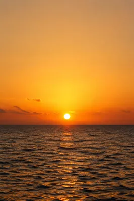 Golden Sunset Over Calm Ocean Horizon