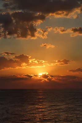 Golden Sunset Over Calm Ocean Horizon