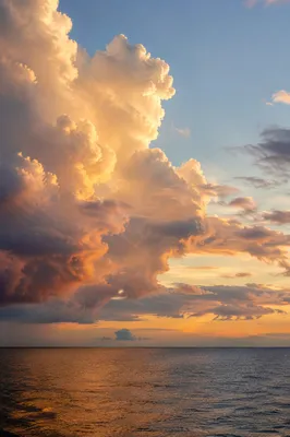 Golden Hour Ocean Horizon with Glowing Clouds