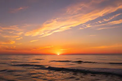 Golden Sunset Over Calm Ocean Horizon