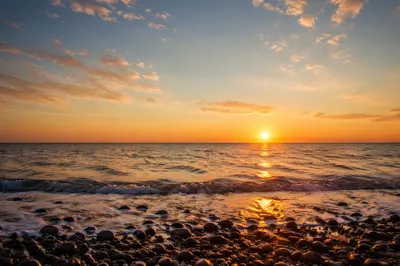 Golden Sunset Over Calm Ocean Horizon