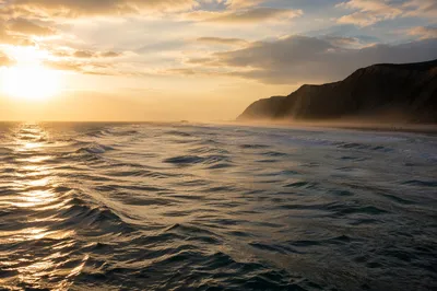 Golden Sunset Over Ocean Cliff Horizon