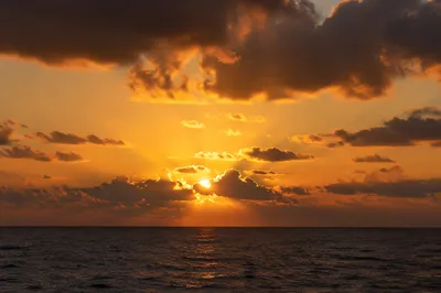 Golden Sunset Over Calm Ocean Horizon