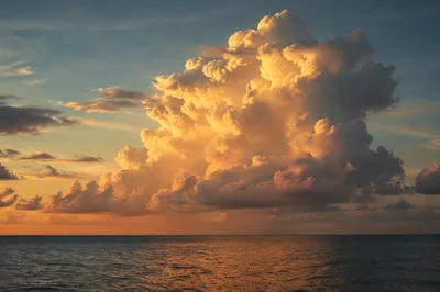Golden Hour Ocean Horizon with Glowing Clouds
