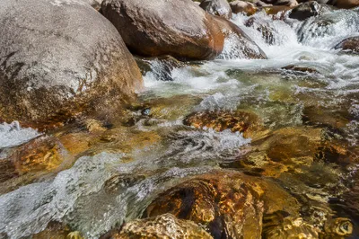 Clear Mountain Stream Over Weathered Boulders