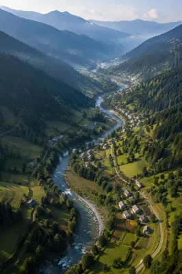 Winding River Through Emerald Mountain Valley
