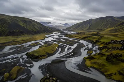 Winding River Through Misty Green Valley