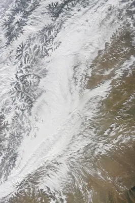 Winter Blizzard Sweeping Across Mountain Plains