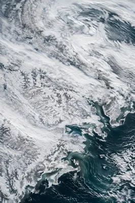 Blizzard Over Frozen Coastal Winter Roads