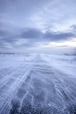 Blizzard Swept Snow Road in Winter