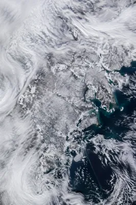 Heavy Blizzard Over Frozen Coastal Road