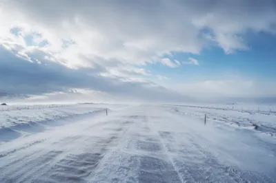 Blizzard Sweeping Across Remote Winter Road