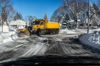 Snowplow Clearing Blizzard Covered Suburban Road