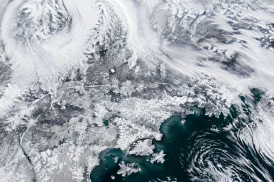 Blizzard Over Frozen Coastal Winter Roads