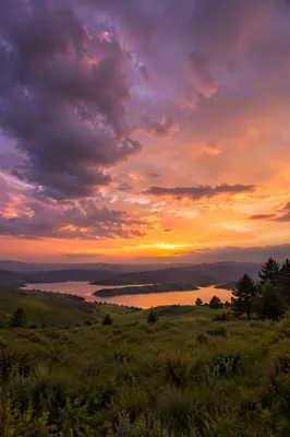 Dramatic Purple Sunset Over Rolling Hills