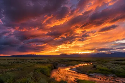 Dramatic Purple Orange Sunset Over Open Plain