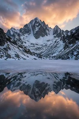 Frozen Alpine Lake at Sunset Reflection