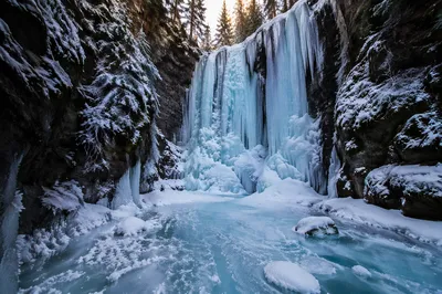 Frozen Blue Waterfall in Winter Ravine