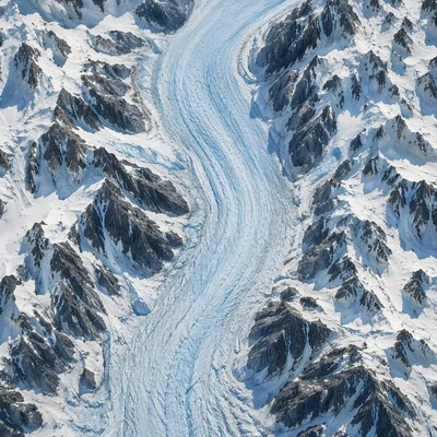 Remote Glacier Through Snowy Mountain Ridges