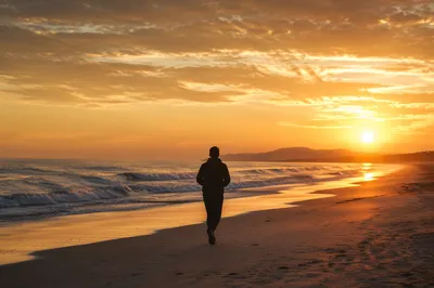 Golden Sunrise Walk on Calm Ocean Shore