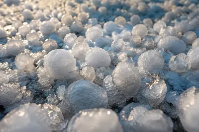 Macro Hailstones on Frozen Ground After Storm