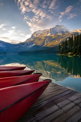 Peaceful Mountain Lake Canoes at Sunrise