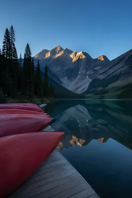 Peaceful Red Canoes at Alpine Lake