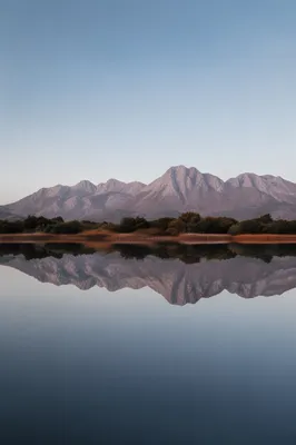 Calm Mountain Lake Reflection at Dawn