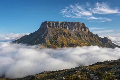 Majestic Mountain Peak Above Morning Clouds