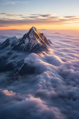 Majestic Mountain Peak Above Morning Clouds