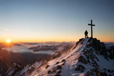 Sunrise Climber Beside Summit Cross