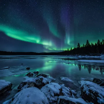 Northern Lights Over Frozen Lake at Night