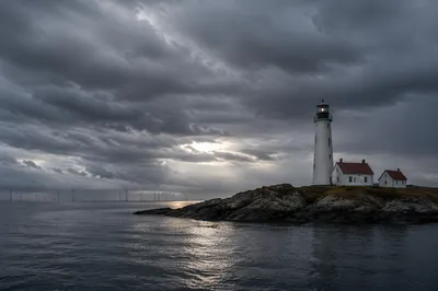 Moody Overcast Sky Above Coastal Lighthouse
