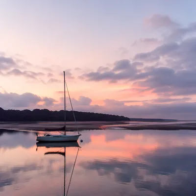 Pink Sunrise Over Calm Bay Sailboat