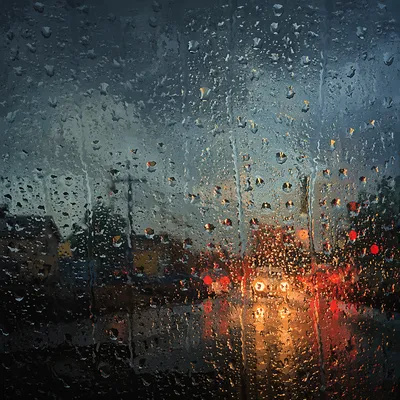 Moody Rain Drops on Window Glass