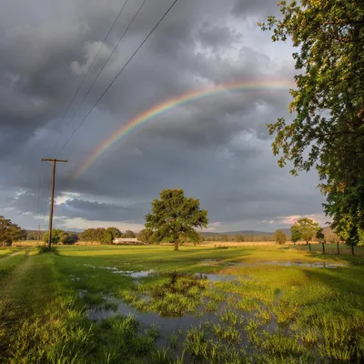 Pastel Rainbow Over Quiet Rainy Countryside