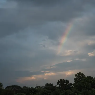 Soft Rainbow Over Moody Evening Sky