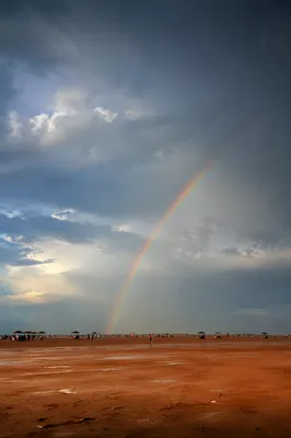 Rainbow Over Sandy Plain After Rain