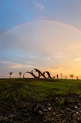Rainbow Over Quiet Post Rain Landscape