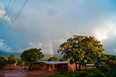 Hopeful Rainbow Over Rural Sky After Rain