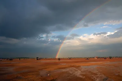 Rainbow Over Sandy Plain After Rain