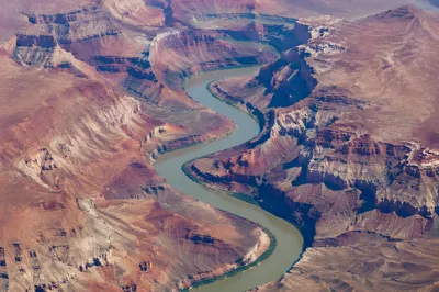 Aerial River Winding Through Desert Canyon