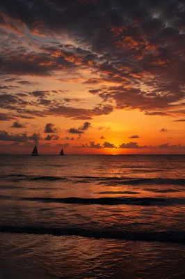 Peaceful Sailboats on Ocean Sunset Horizon